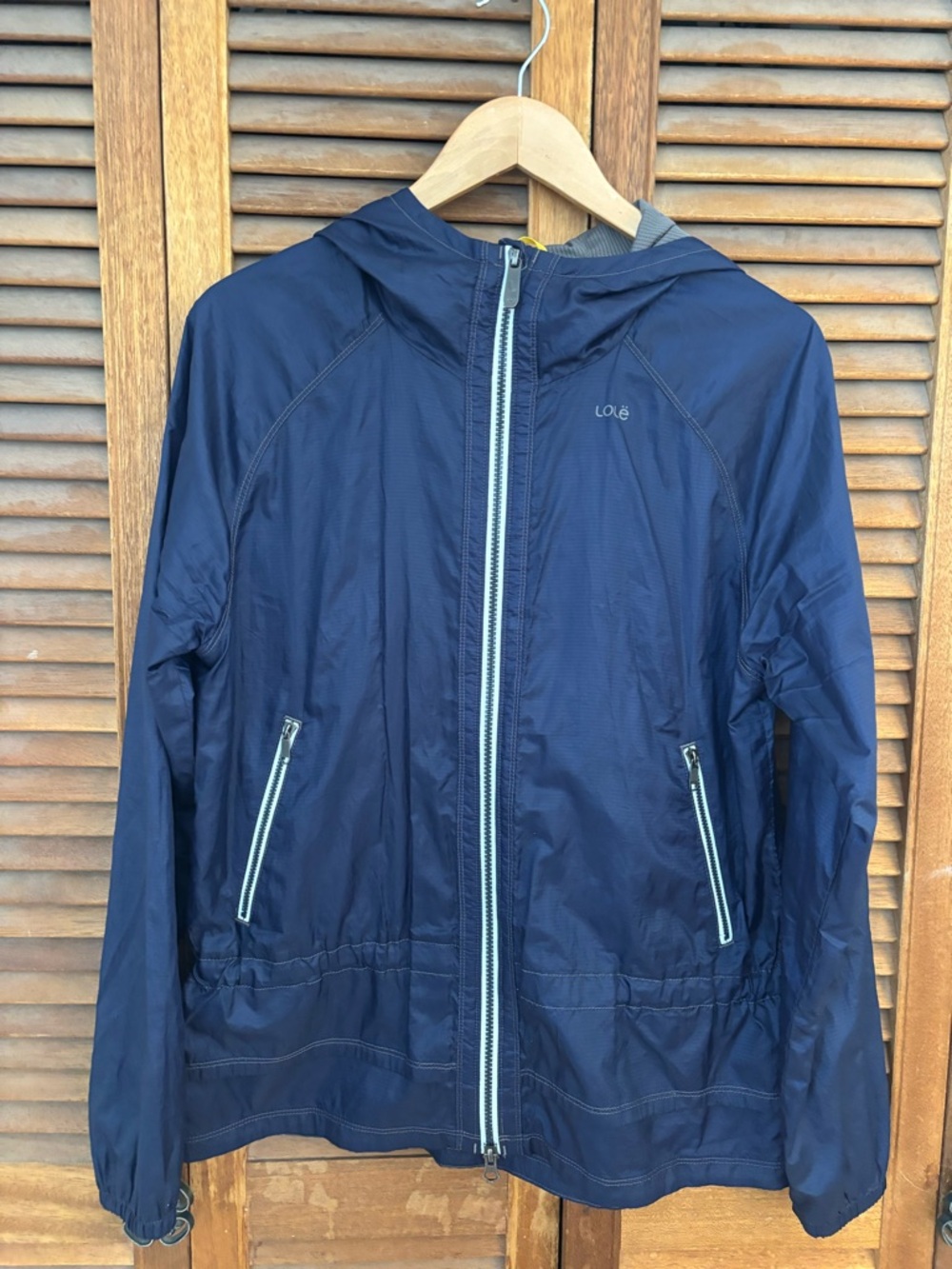 Lole Dark Navy Hooded Jacket with White Logo. Wind proof and water resistant. Lg
